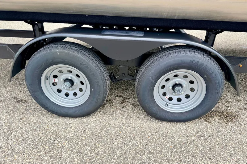 Slide: The Image of Trailer wheels of a 2015 Manitou 25 SES BENCH on asphalt surface. - 99