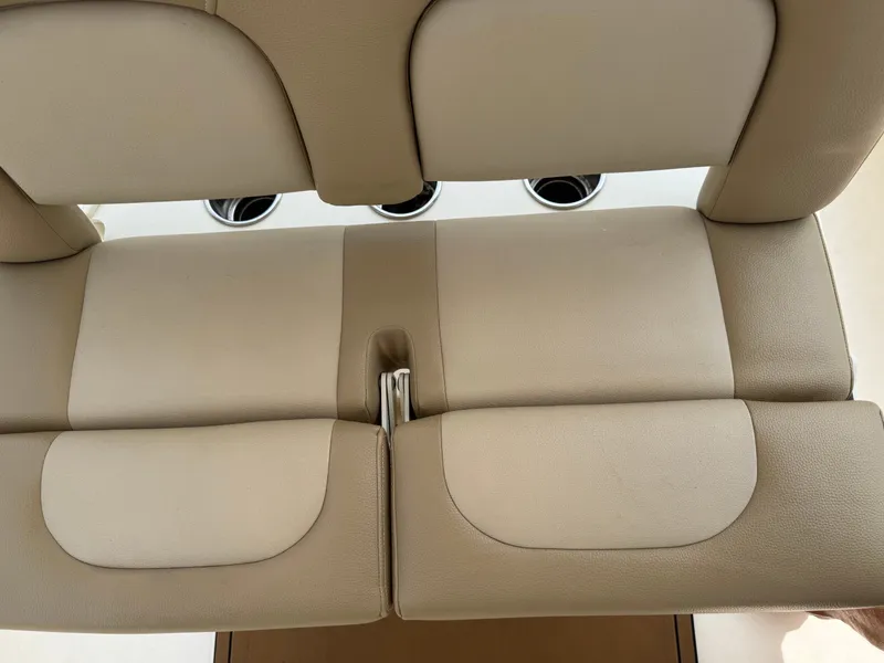 Slide: The Image of Beige upholstered seats with cup holders on a boat. - 45