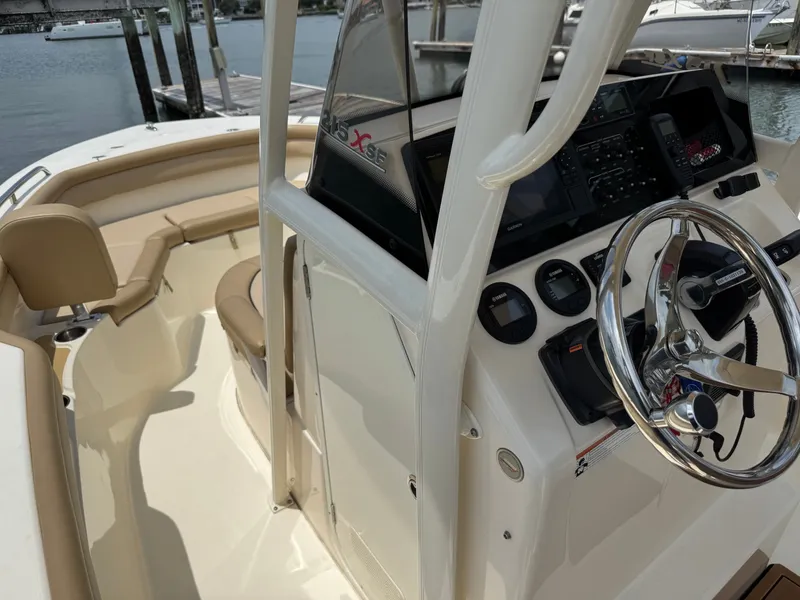 Slide: The Image of The image shows the cockpit of a 2019 Scout 215 XSF with a sleek helm station. - 15