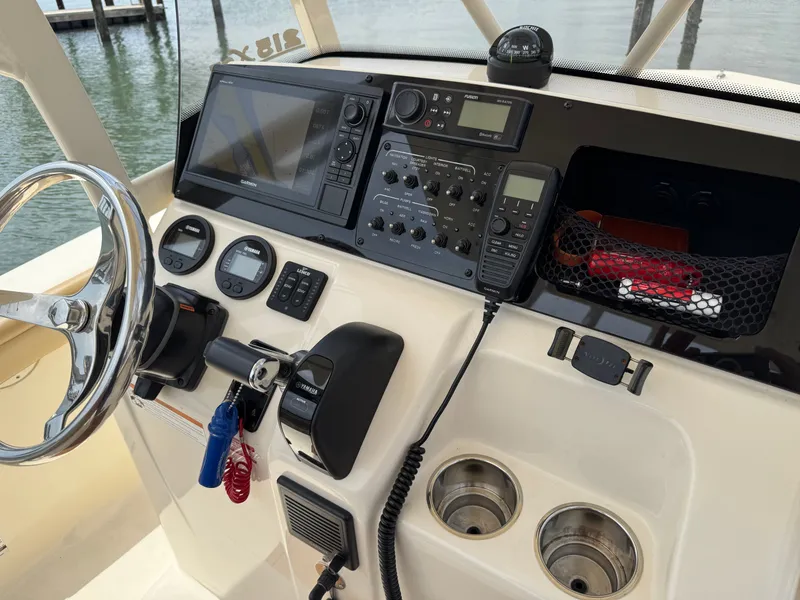 Slide: The Image of The 2019 Scout 215 XSF cockpit features a modern helm with instruments and controls. - 10