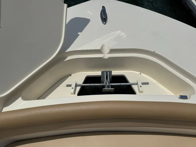Slide: The Image of An anchor compartment on a boat with an anchor and fittings, surrounded by beige upholstery. - 32