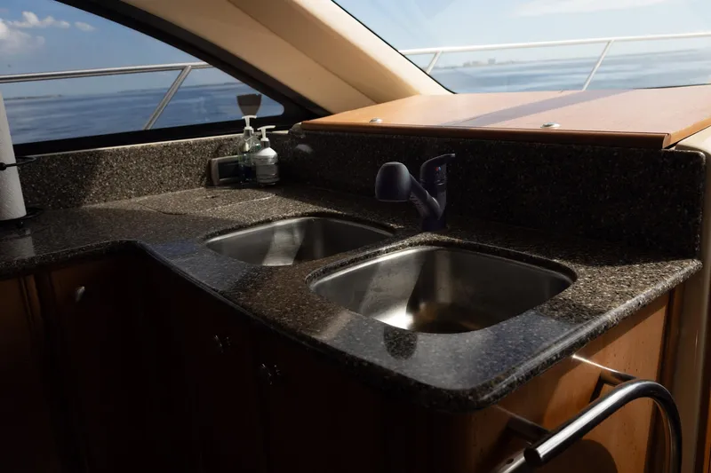 Slide: The Image of Luxurious kitchen sink area on a 2004 Meridian 411 Sedan yacht. - 17