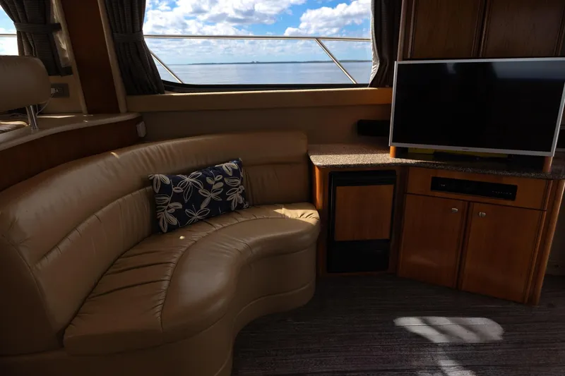 Slide: The Image of Luxurious interior of a 2004 Meridian 411 Sedan yacht with leather seating and a TV. - 16