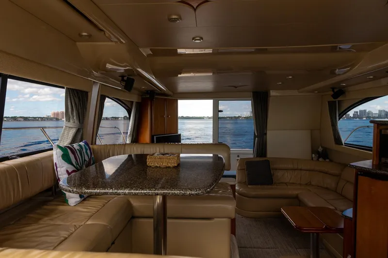 Slide: The Image of Luxurious interior of a 2004 Meridian 411 Sedan yacht with waterfront views. - 19