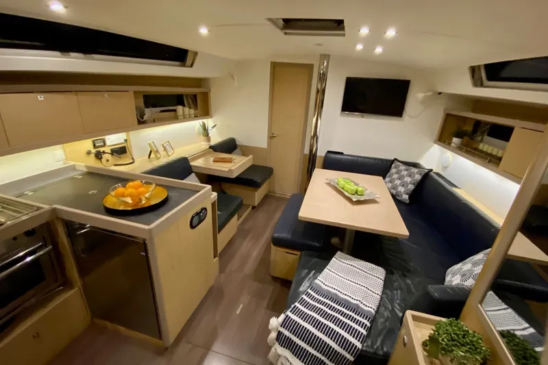 Slide: The Image of Luxurious interior of 2017 Beneteau Oceanis 45 yacht with modern kitchen and cozy seating area. - 35