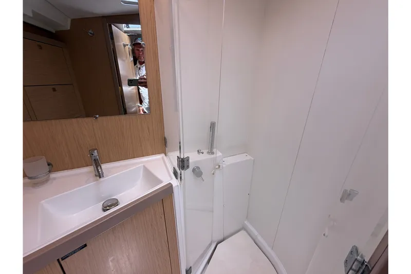 Slide: The Image of Bathroom interior of 2017 Beneteau Oceanis 45 yacht, featuring sink and shower area. - 39