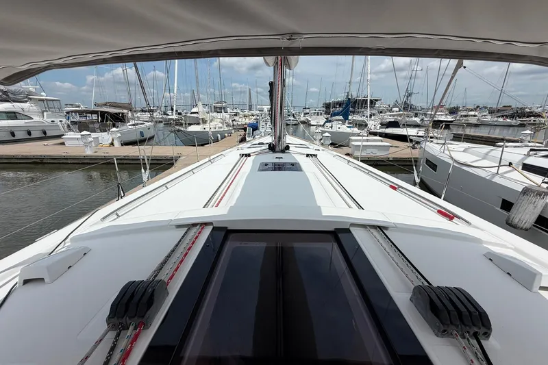 Slide: The Image of 2017 Beneteau Oceanis 45 sailboat docked at marina, showcasing sleek deck design. - 16