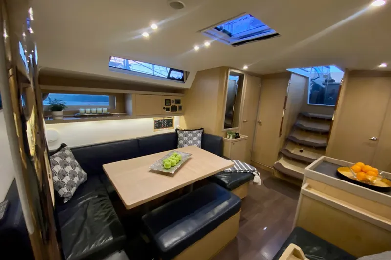 Slide: The Image of Luxurious interior of 2017 Beneteau Oceanis 45 yacht with modern dining area. - 33