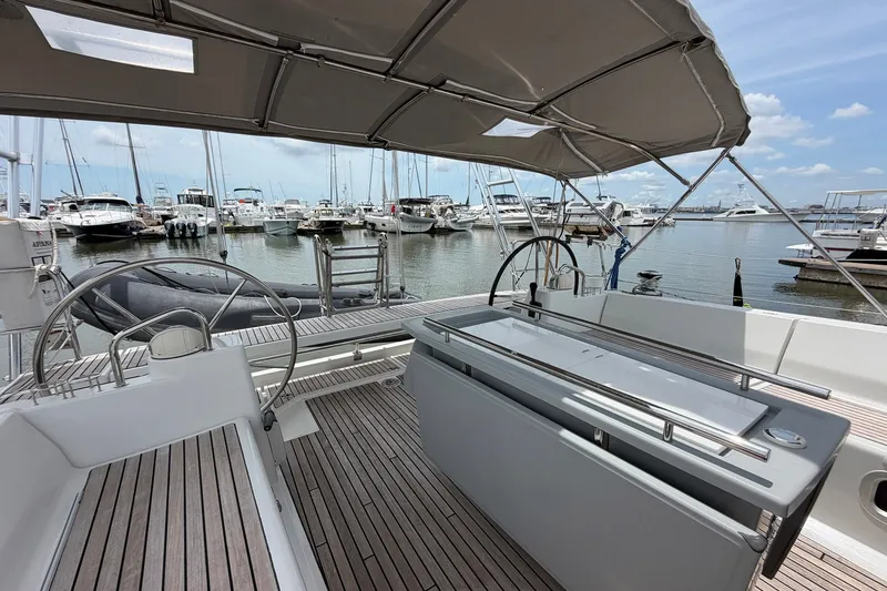 Slide: The Image of Spacious cockpit of 2017 Beneteau Oceanis 45 yacht docked at marina. - 22