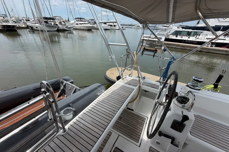 Slide: The Image of Beneteau Oceanis 45 sailboat cockpit, 2017 model, docked at marina with steering wheel and equipment. - 26