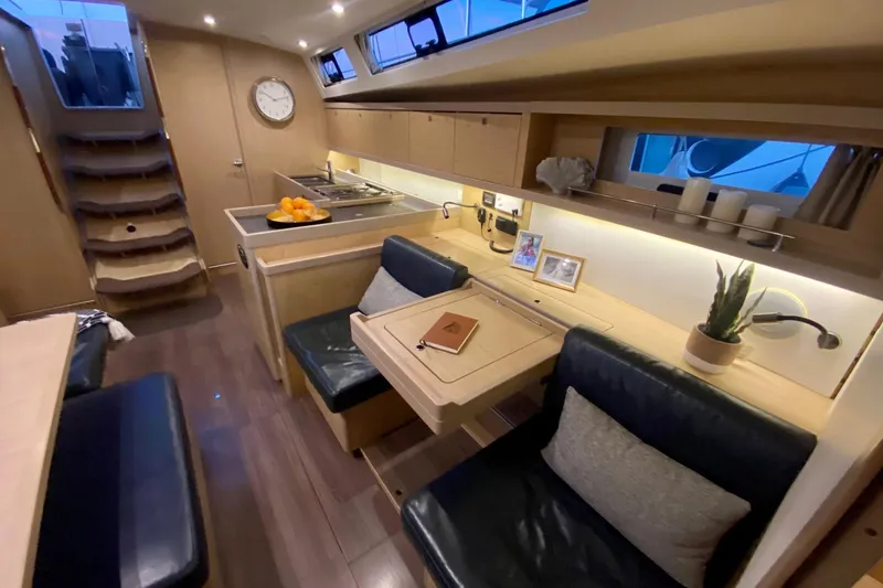 Slide: The Image of Interior of 2017 Beneteau Oceanis 45 yacht, featuring modern kitchen and cozy seating area. - 35
