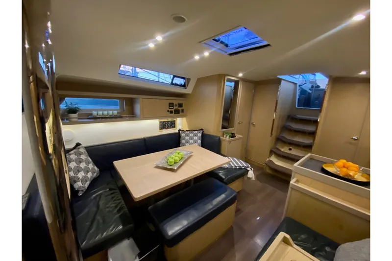 Slide: The Image of Interior of 2017 Beneteau Oceanis 45 yacht with cozy seating and modern design. - 30