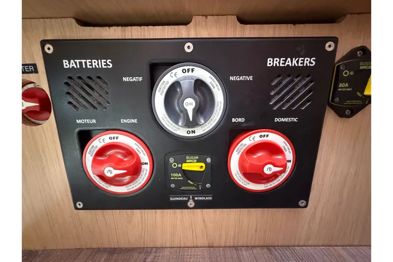Slide: The Image of Control panel of a 2017 Beneteau Oceanis 45 yacht, featuring battery and breaker switches. - 61