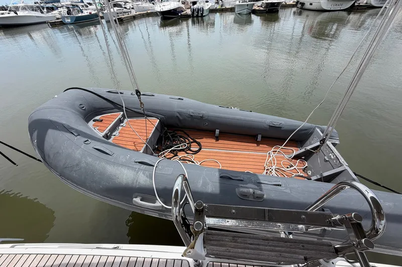 Slide: The Image of Inflatable dinghy on water near Beneteau Oceanis 45, 2017 model, docked at marina. - 24