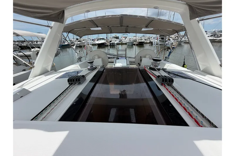 Slide: The Image of 2017 Beneteau Oceanis 45 yacht cockpit with marina view, showcasing sleek design and modern features. - 17