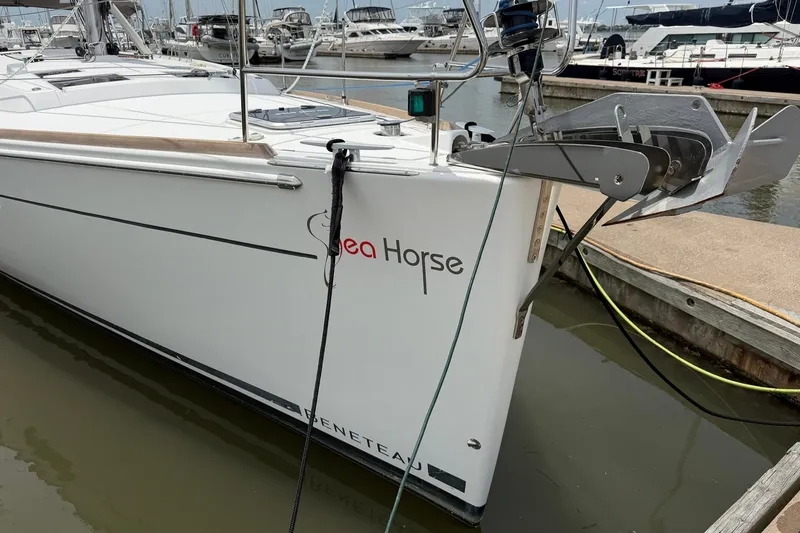 Slide: The Image of 2017 Beneteau Oceanis 45 sailboat named "Sea Horse" docked at a marina. - 7