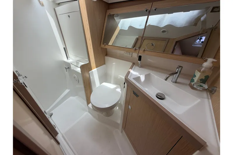 Slide: The Image of Modern bathroom in 2017 Beneteau Oceanis 45 yacht, featuring sleek fixtures and ample storage. - 43