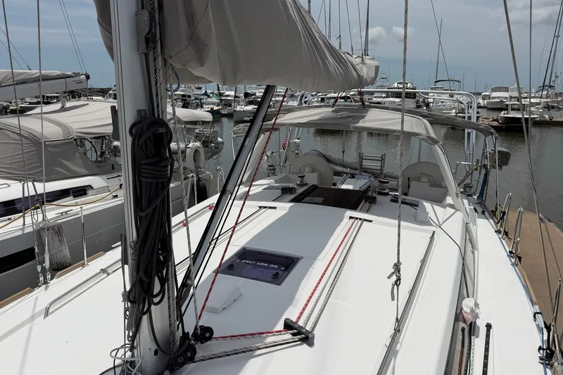 Slide: The Image of 2017 Beneteau Oceanis 45 sailboat docked at marina, showcasing deck and rigging. - 12