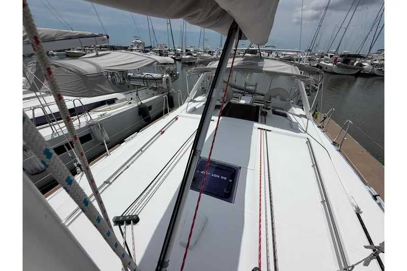 Slide: The Image of 2017 Beneteau Oceanis 45 sailboat docked at marina, showcasing deck and rigging. - 15