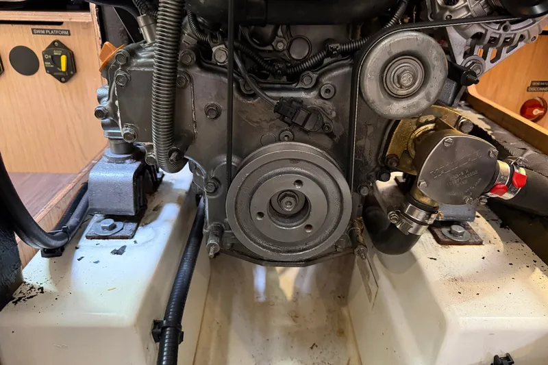 Slide: The Image of Engine compartment of a 2017 Beneteau Oceanis 45 sailboat, showcasing mechanical components. - 50