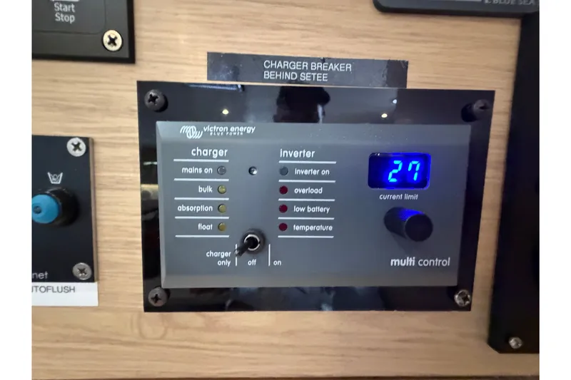 Slide: The Image of Control panel of a 2017 Beneteau Oceanis 45 yacht, displaying charger and inverter settings. - 58