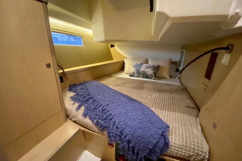 Slide: The Image of Cozy cabin interior of 2017 Beneteau Oceanis 45 yacht with plush bedding. - 44