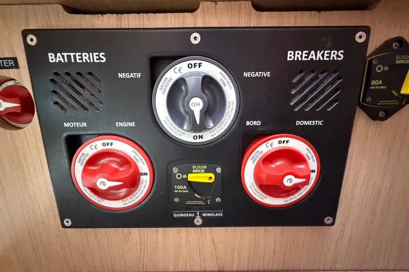 Slide: The Image of Control panel of a 2017 Beneteau Oceanis 45 yacht, featuring battery and breaker switches. - 64