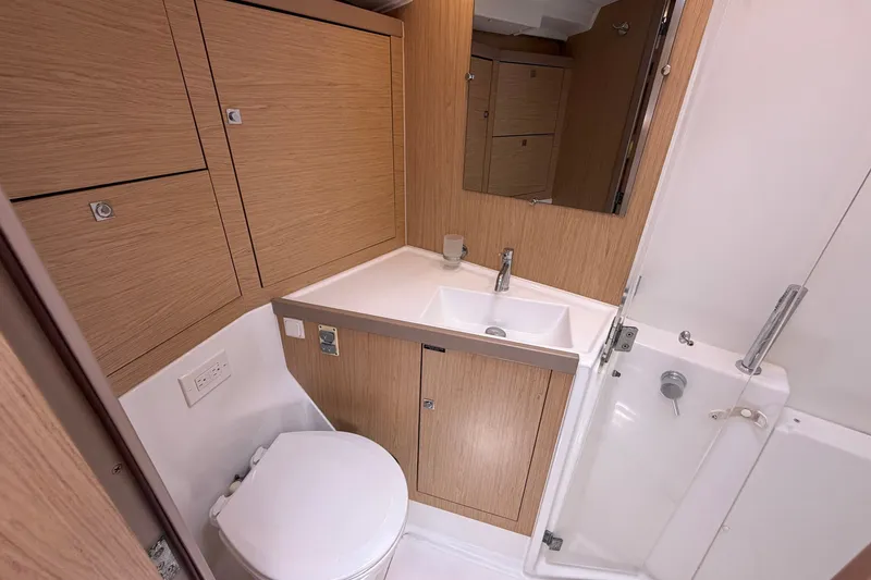 Slide: The Image of Modern bathroom in 2017 Beneteau Oceanis 45 yacht with wood cabinetry and compact design. - 41