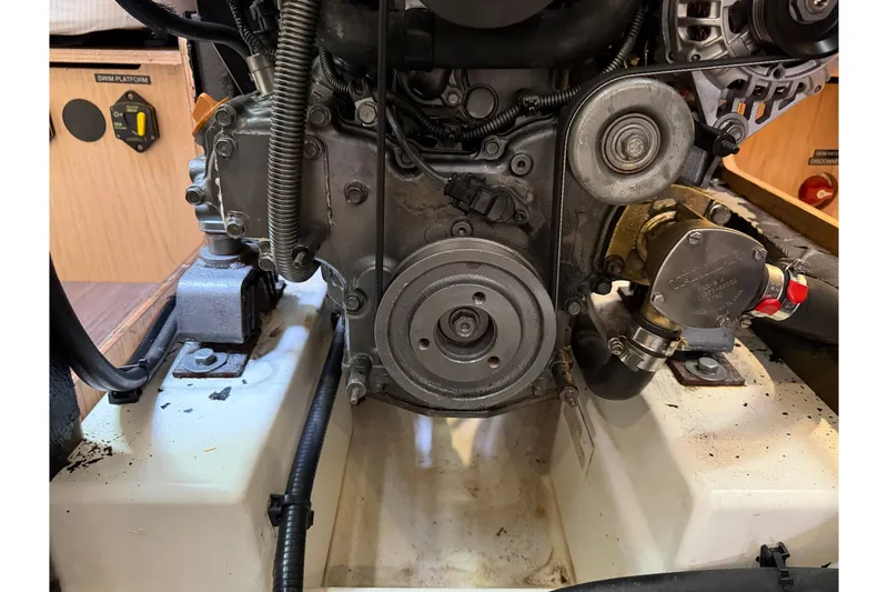 Slide: The Image of Engine compartment of a 2017 Beneteau Oceanis 45 sailboat, showcasing mechanical components. - 47