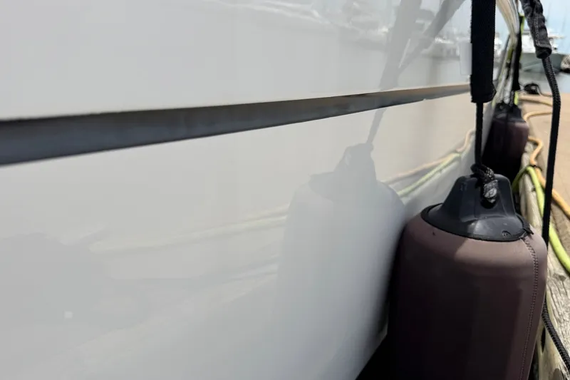 Slide: The Image of Close-up of 2017 Beneteau Oceanis 45 yacht hull with fenders attached. - 9