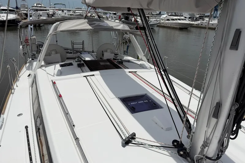 Slide: The Image of 2017 Beneteau Oceanis 45 sailboat docked at marina, showcasing deck and rigging. - 12