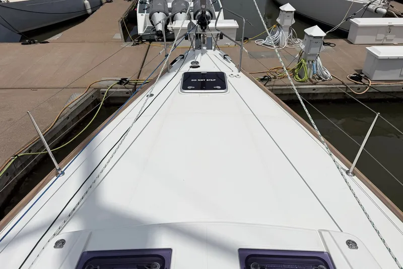 Slide: The Image of Deck view of a 2017 Beneteau Oceanis 45 yacht docked at a marina. - 10