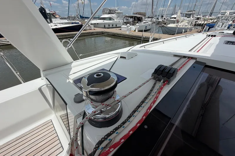 Slide: The Image of Beneteau Oceanis 45 sailboat deck with winch and ropes, docked at marina, 2017 model. - 19