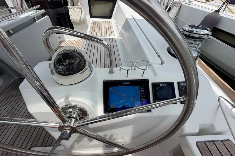 Slide: The Image of Steering wheel and navigation instruments on 2017 Beneteau Oceanis 45 yacht deck. - 30