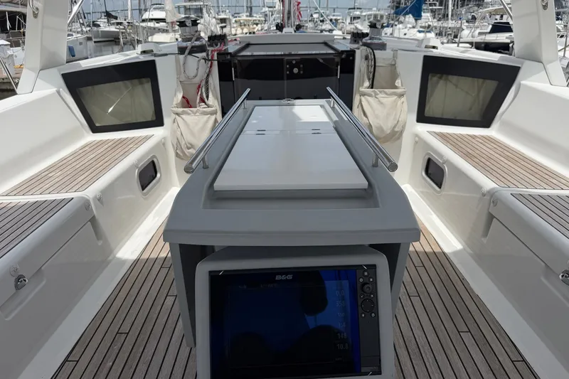 Slide: The Image of 2017 Beneteau Oceanis 45 yacht cockpit with modern navigation equipment and teak flooring. - 21