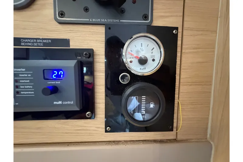 Slide: The Image of Control panel of a 2017 Beneteau Oceanis 45 yacht, showing gauges and inverter settings. - 59