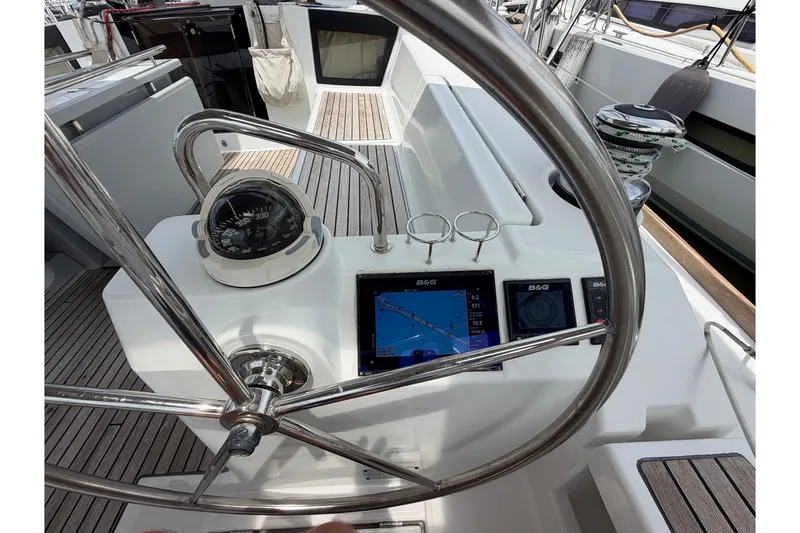 Slide: The Image of Steering wheel and navigation instruments on 2017 Beneteau Oceanis 45 yacht. - 27