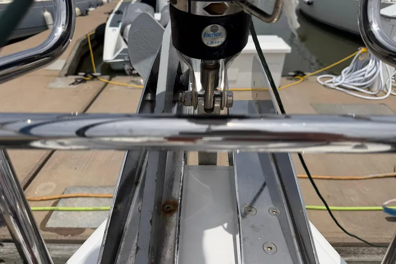 Slide: The Image of Close-up of a 2017 Beneteau Oceanis 45 yacht's bow with dock in background. - 13