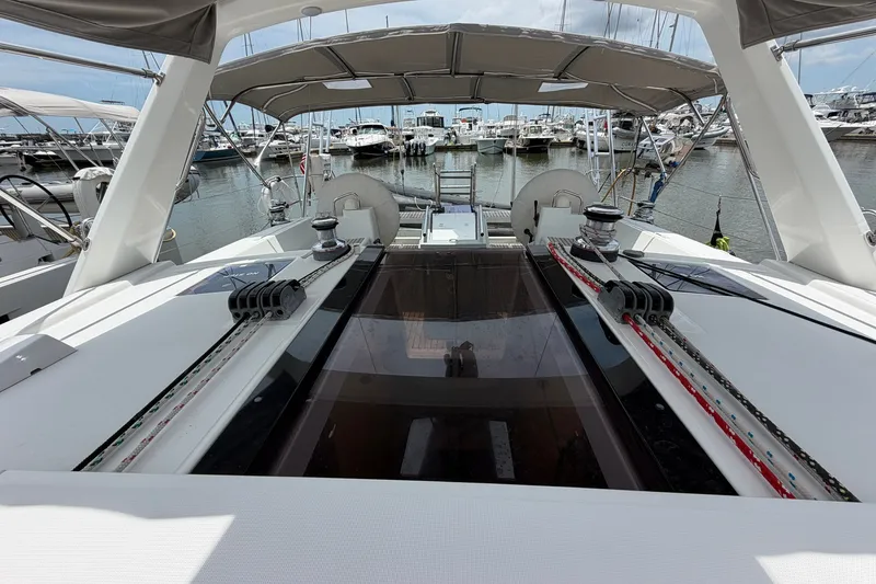 Slide: The Image of 2017 Beneteau Oceanis 45 yacht docked at marina, showcasing spacious deck and modern design. - 18
