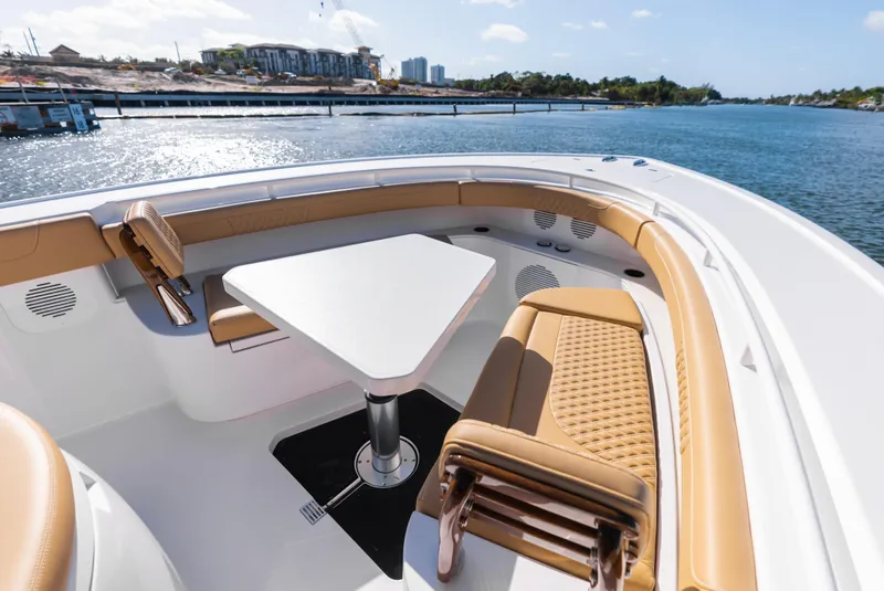 Slide: The Image of Luxurious seating area on 2026 Phenom 34 Center Console boat, with scenic waterfront view. - 23