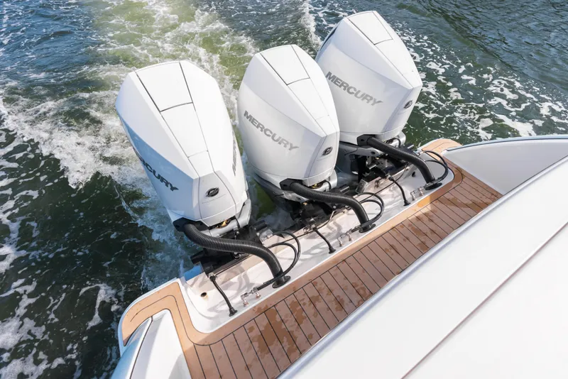 Slide: The Image of 2026 Phenom 34 Center Console with triple Mercury outboard engines on water. - 15