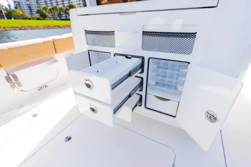 Slide: The Image of 2026 Phenom 34 Center Console boat with open storage compartments and drawers. - 18
