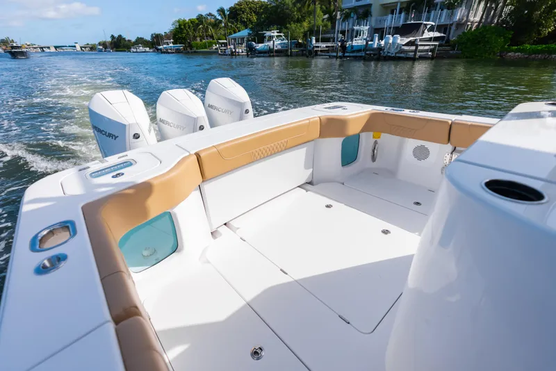Slide: The Image of 2026 Phenom 34 Center Console boat with Mercury engines on a sunny waterway. - 13