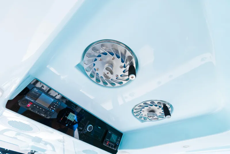 Slide: The Image of 2026 Phenom 34 Center Console boat interior with advanced control panel and ventilation system. - 7
