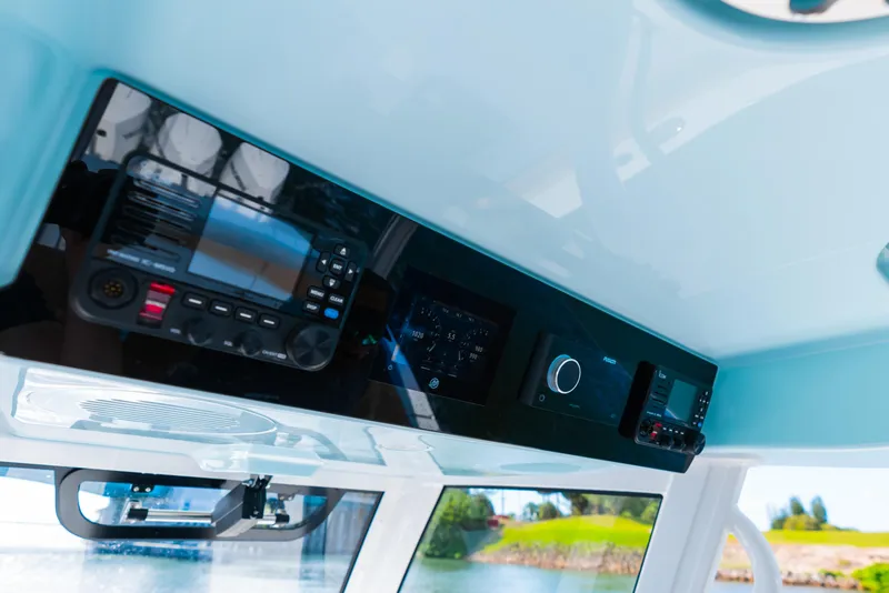 Slide: The Image of 2026 Phenom 34 Center Console dashboard with advanced navigation and control systems. - 6