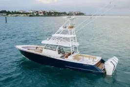 The Image of Phenom 43 Center Console 2027 boat on calm water, featuring sleek design and powerful engines. - 0