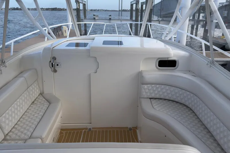 Slide: The Image of 2006 Intrepid 377 Walkaround boat interior with white seating and ocean view. - 18