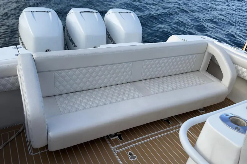 Slide: The Image of Luxury seating on a 2006 Intrepid 377 Walkaround boat with triple Mercury engines. - 11