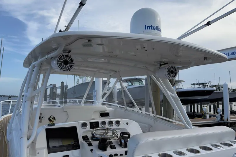 Slide: The Image of 2006 Intrepid 377 Walkaround boat cockpit with advanced navigation and audio systems. - 14