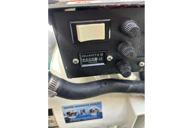 Slide: The Image of Control panel with hour meter on 2006 Intrepid 377 Walkaround boat. - 28